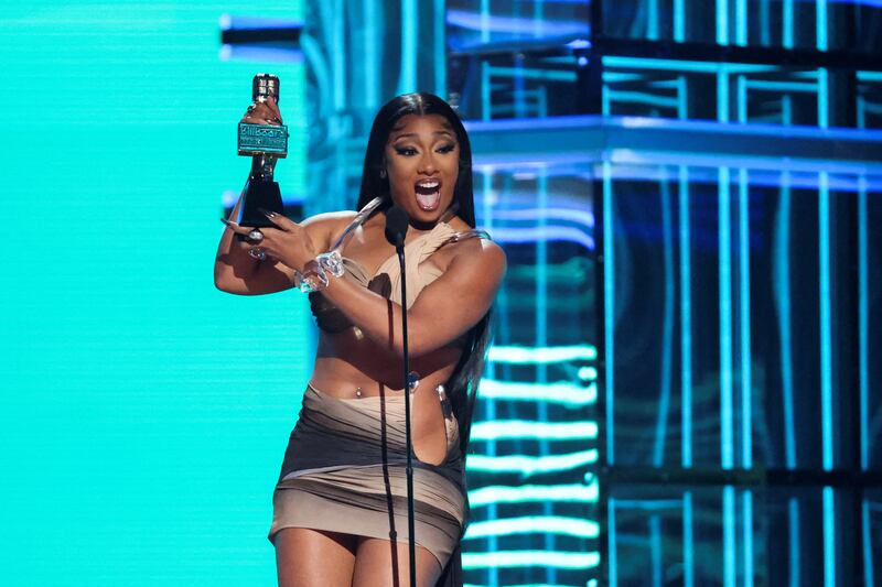 Megan Thee Stallion reacts after winning the Top Rap Female Artist award. Reuters