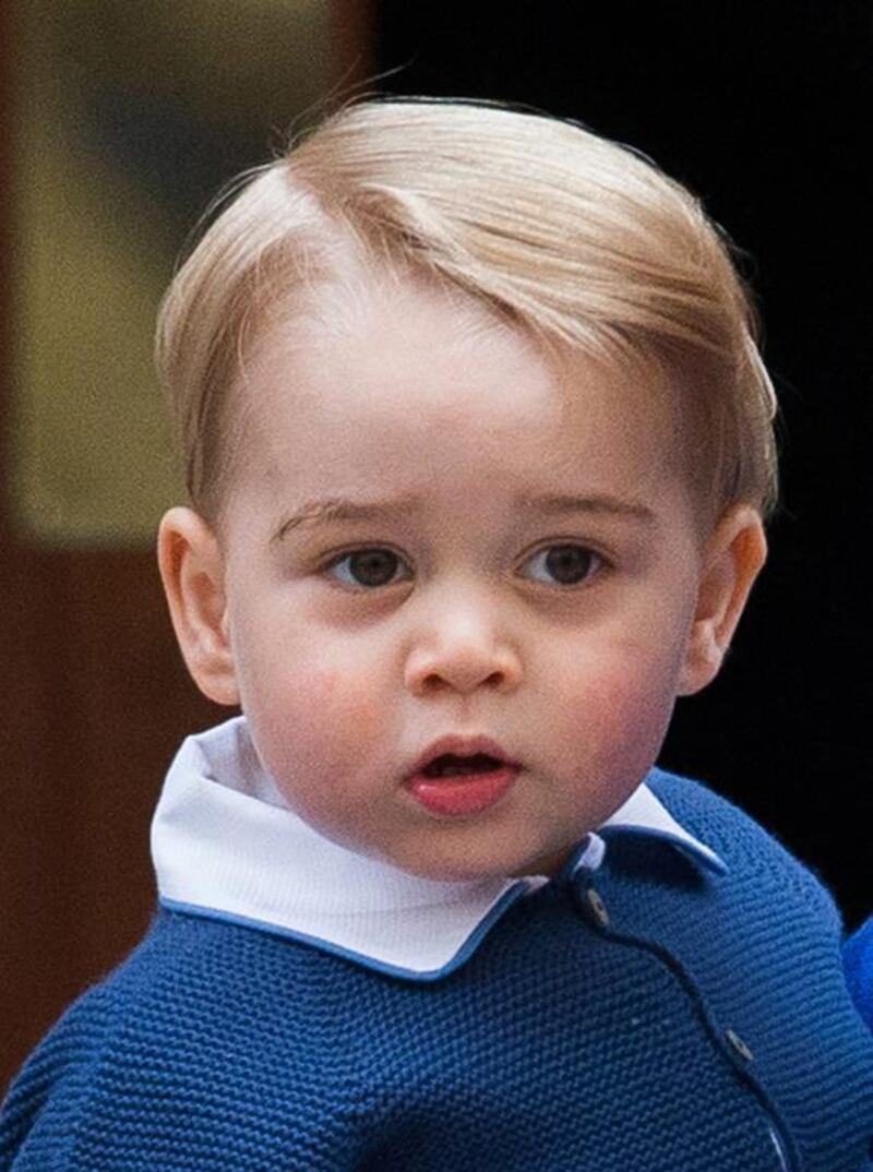 Britain’s Prince George being carried by his father, the Duke of Cambridge, as they arrive at the Lindo Wing to visit his mother and newborn baby sister at St Mary’s Hospital in Paddington, west London, Britain. Andrew Cowie / EPA