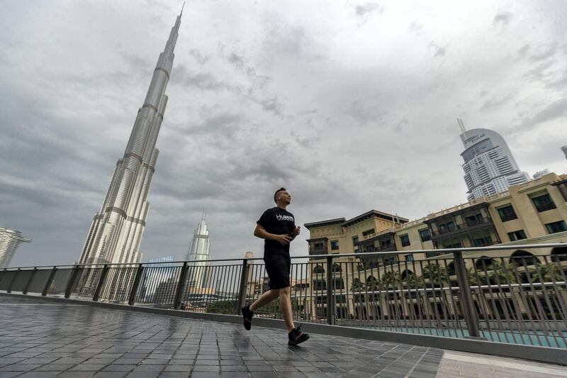 Dubai, United Arab Emirates - Reporter: N/A. Standalone. Dark clouds and rain surround the Burj Khalifa. Tuesday, December 10th, 2019. Downtown, Dubai. Chris Whiteoak / The National