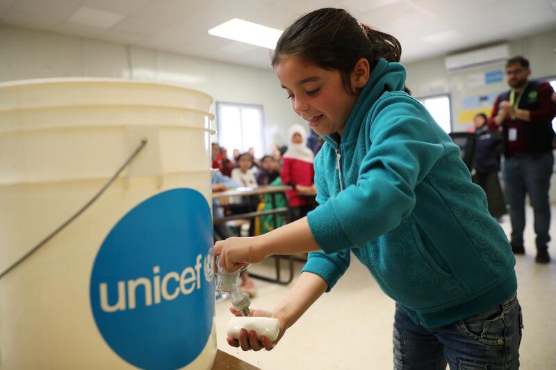 A Syrian refugee student takes part in a washing hands activity as part of an awareness campaign about coronavirus initiated by OXFAM and UNICEF at Al Zaatari refugee camp in Jordan.  Reuters