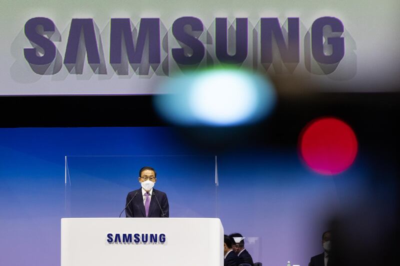 Kim Ki-nam, co-vice chairman and co-chief executive officer of Samsung Electronics Co., speaks from behind a transparent screen during the company's annual general meeting at the Suwon Convention Center in Suwon, South Korea. Bloomberg