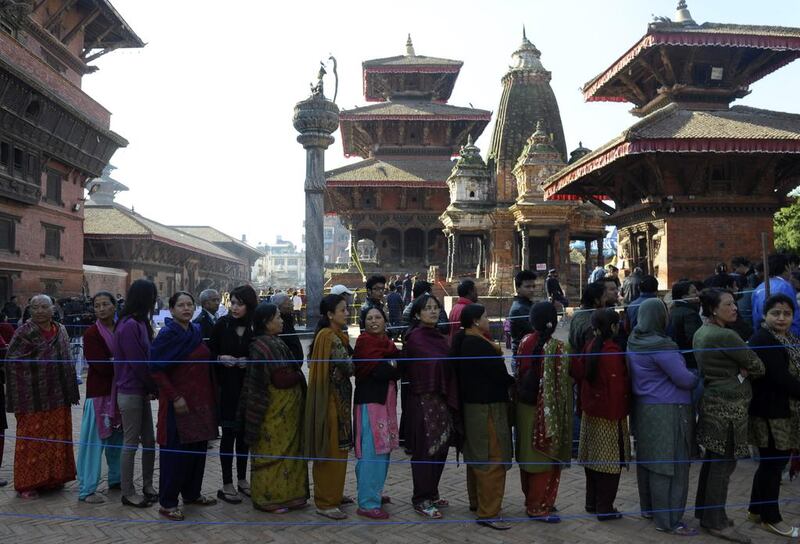 Nepalese voters queue to cast their ballots at a polling station in Patan on the outskirts of Kathmandu, during the second free election in the country’s history in November. AFP / Prakash Mathema 

