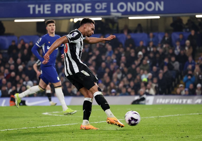 Jacob Murphy shoots to score Newcastle's second goal to reduce Chelsea's lead to 3-2. Reuters