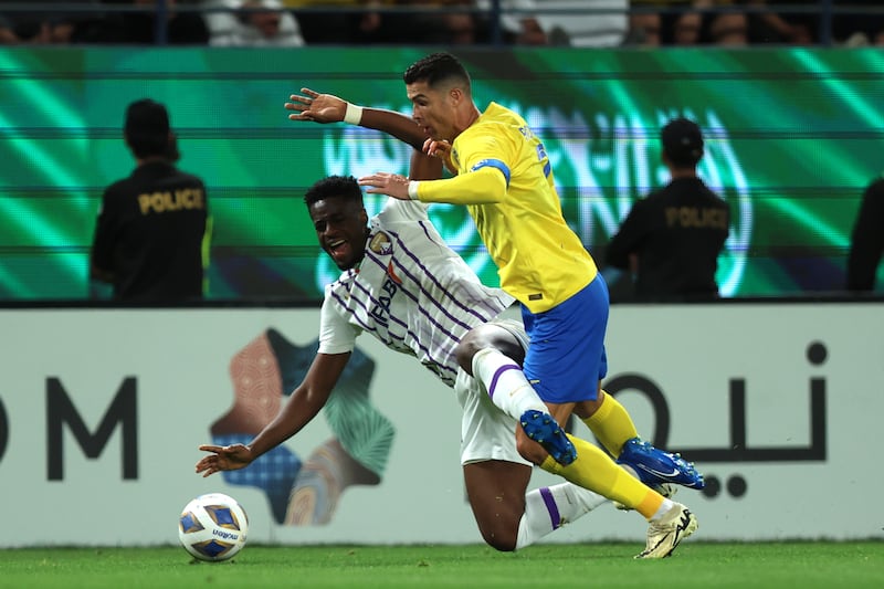 Kouame Kouadio of Al Ain is challenged by Al Nassr's Cristiano Ronaldo. Getty Images