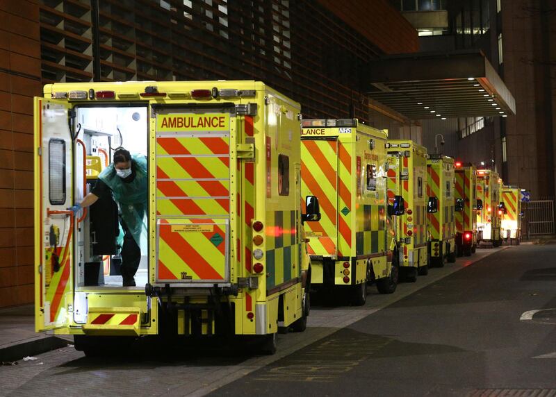 A row of ambulances are parked outside the Royal London Hospital in London. AP Photo