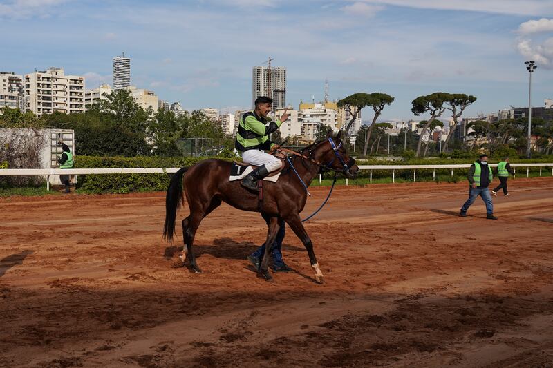 The jockey of Troy, the winning horse, celebrates a victory.