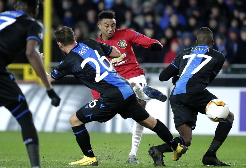 Mats Rits, left, and Clinton Mata of Brugge in action against Jesse Lingard of Manchester United. EPA