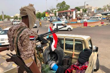 A fighter of Yemen's Southern Transitional Council forces mans the turret of a pickup truck mounted with an anti-aircraft gun in Khor Maksar district of Aden. AFP