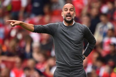 Manchester City's Spanish manager Pep Guardiola gestures on the touchline during the English Premier League football match between Arsenal and Manchester City at the Emirates Stadium in London on August 12, 2018. (Photo by Glyn KIRK / AFP) / RESTRICTED TO EDITORIAL USE. No use with unauthorized audio, video, data, fixture lists, club/league logos or 'live' services. Online in-match use limited to 120 images. An additional 40 images may be used in extra time. No video emulation. Social media in-match use limited to 120 images. An additional 40 images may be used in extra time. No use in betting publications, games or single club/league/player publications. / 