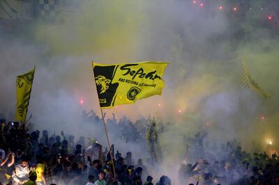 Sepahan fans set off fireworks before the fixture was called off. Tasnim News Agency via AP