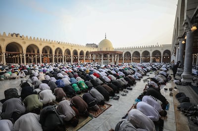 Muslims gather to perform Eid Al Fitr prayers at a mosque in Cairo. Getty Images