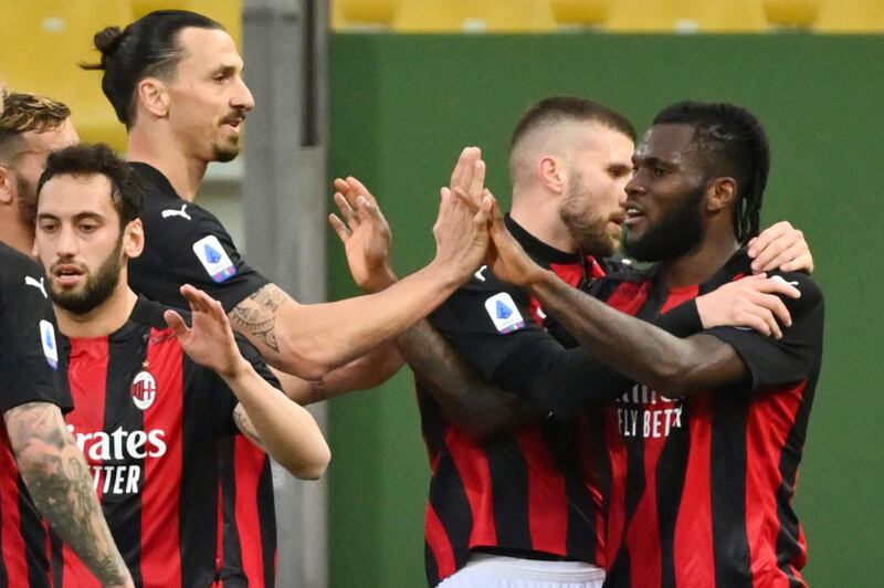 Milan's Franck Kessie, right, celebrates with teammates Ante Rebic and Zlatan Ibrahimovic after scoring his side's second goal. AP