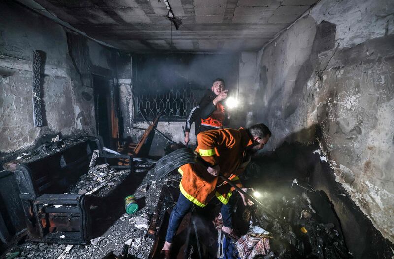 The fire ripped through a home north of Gaza City, killing at least 21 people, including seven children. AFP