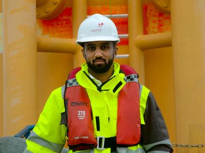 Husain Al Meer, general manager for Masdar UK, at one of the Hywind Scotland turbines in the North Sea. Paul Peachey / The National