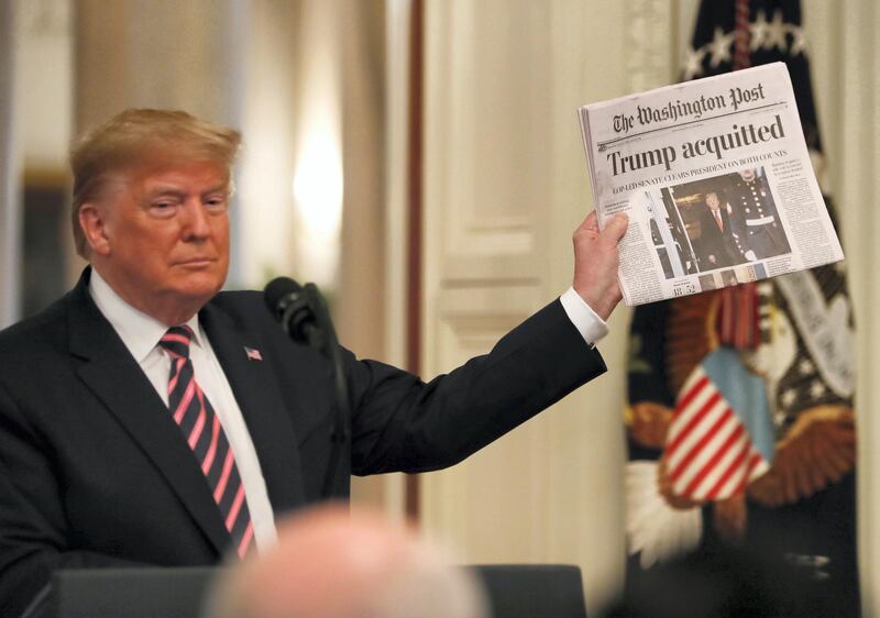 epa08939630 (FILE) US President Donald J. Trump holds the front page of the Washington Post with headline 'Trump acquitted' as he speaks in the East Room of the White House a day after his Senate impeachment trial acquittal in Washington, DC, USA, 06 February 2020. Trump was found not guilty on two articles of impeachment 05 February 2020 after a two-week trial. The presidency of Donald Trump, which records two presidential impeachments, will end at noon on 20 January 2021.  EPA-EFE/ERIK S. LESSER *** Local Caption *** 56621645