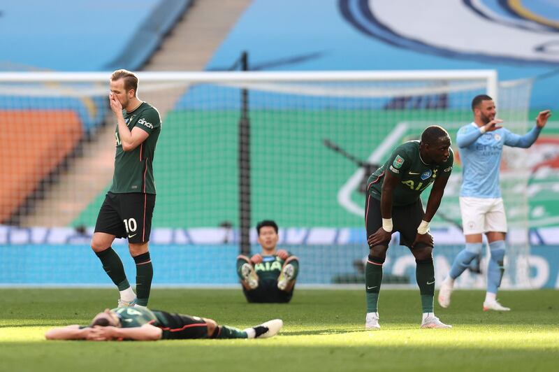 Dejected Harry Kane, left, and Spurs teammates after the final whistle. Getty