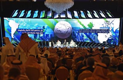 A picture taken October 23, 2018 shows (L to R) Lubna Olayan, CEO and Deputy Chairperson Olayan Financing, Yesir al-Rumayyan, Saudi managing director of Public investment Fund, Kirill Dmitriev, CEO of Rusian Direct Investment Fund and Khaldoon Khalifa al-Mubarak, managing director and CEO of Mubadala Development Company, speaking at  the opening ceremony of the Future Investment Initiative FII conference in the Saudi capital Riyadh.  Saudi Arabia is hosting a key investment summit overshadowed by the killing of critic Jamal Khashoggi that has prompted a wave of policymakers and corporate giants to withdraw. / AFP / FAYEZ NURELDINE
