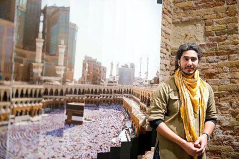 Ahmad Angawi with his lenticular photograph that shows a traditional view of Mecca from one angle and a view of the city choked with new high-rise architecture from another. Photo by Sofia Dadurian