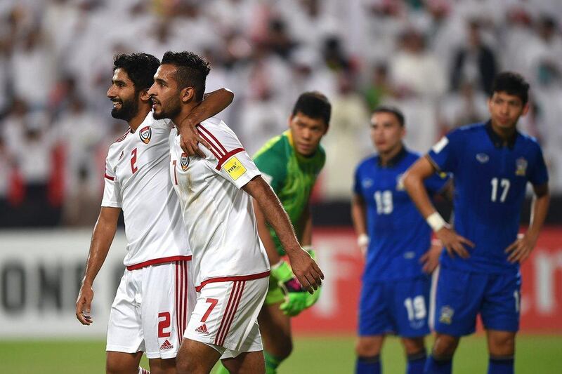 Ali Mabkhout, right, celebrates with teammate Salem Saleh after scoring against Thailand on Thursday night in Abu Dhabi. Tom Dulat / Getty Images / October 6, 2016