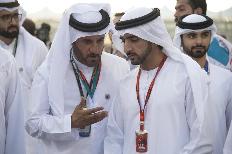 Mohammed bin Sulayem, left, with Sheikh Hamdan bin Mohammed, Crown Prince of Dubai, during a pit lane walk prior to the final race of the Grand Prix. Mohamed Al Suwaidi / Crown Prince Court - Abu Dhabi