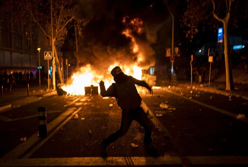 A man throws a missile during the Catalan pro-independence protest outside the Camp Nou. AP