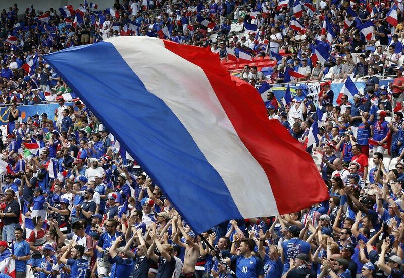 French supporters pack the stadium as a giant France flag is waved ahead of kick-off. Sergey Dolzhenko / EPA