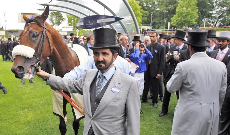Sheikh Mohammed with his racehorse Rewilding after the four-year-old thoroughbred won the Prince Of Wales’s Stakes at Royal Ascot in June 2011. Photo: racingfotos.com
