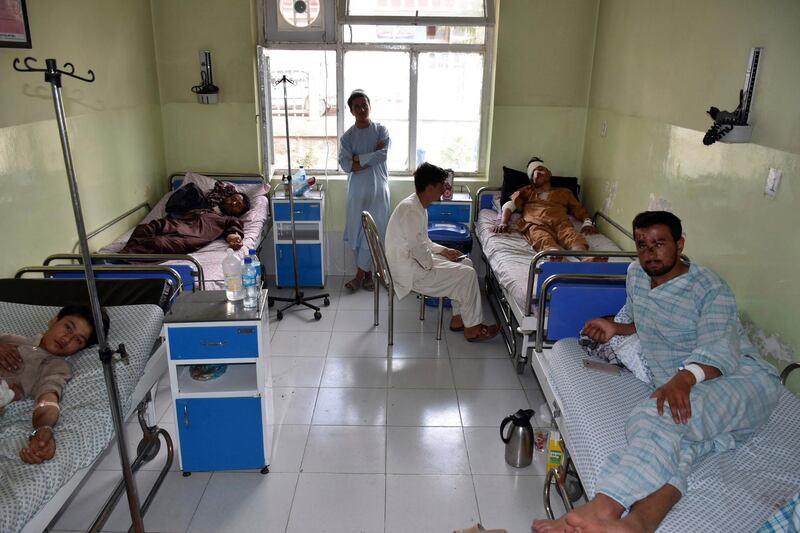 Wounded men receive treatment at a hospital after a bomb blast on an intelligence compound in Aybak, the capital of the Samangan province in northern Afghanistan. AP