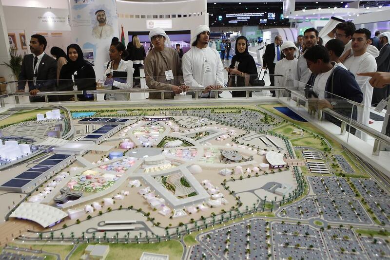 Visitors looks at a model of Expo 2020 at the World Future Energy Summit 2017 at the Abu Dhabi Exhibition Center. Ravindranath K / The National