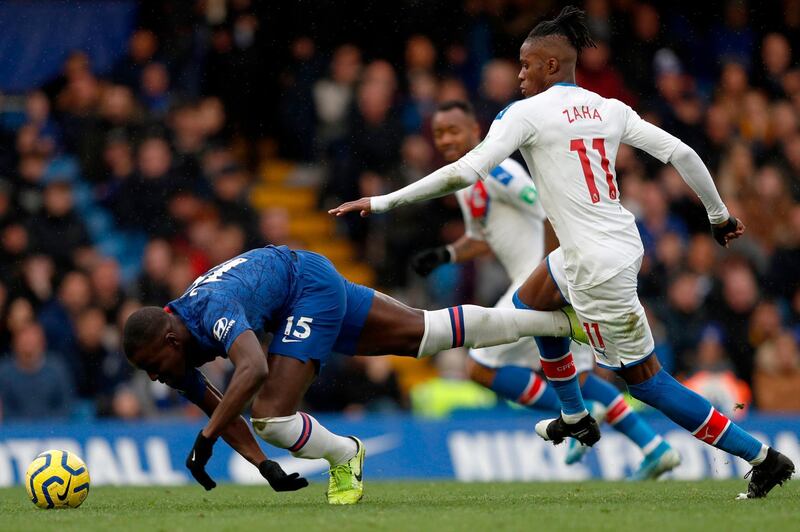 Chelsea defender Kurt Zouma, left, vies for the ball with Crystal Palace's Wilfried Zaha in London. AFP