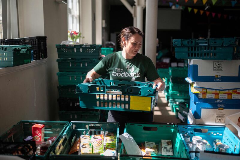 Volunteers in Bradford, northern England, prepare food parcels at the Bradford Central Foodbank. More and more people are visiting the centre. AFP