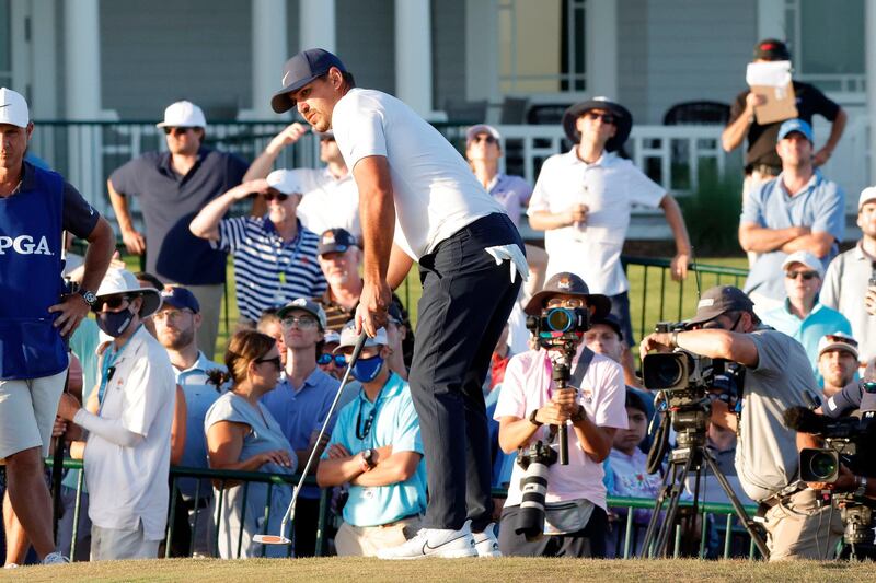 Brooks Koepka putts on the 18th green. Reuters