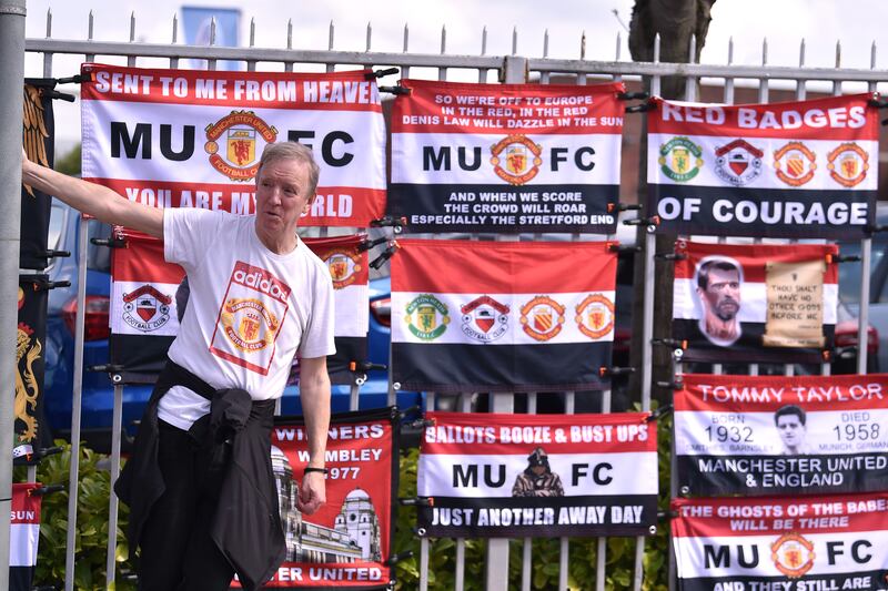 A street vendor is seen selling Manchester United flags outside the stadium. Getty
