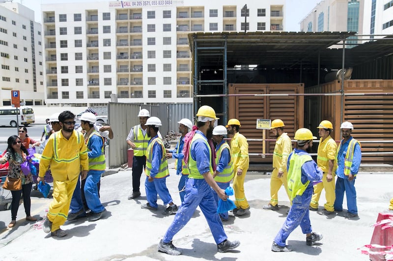 DUBAI, UNITED ARAB EMIRATES - MAY 28, 2018. 

The Ramadan Sharing Fridges initiative in Dubai, distributes meals to construction workers in Bur Dubai.

(Photo by Reem Mohammed/The National)

Reporter: Nawal Al Ramahi
Section: NA