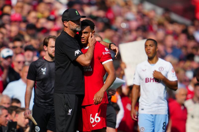 Liverpool's Trent Alexander-Arnold gets a hug from manager Jurgen Klopp after leaving the pitch injured. AP