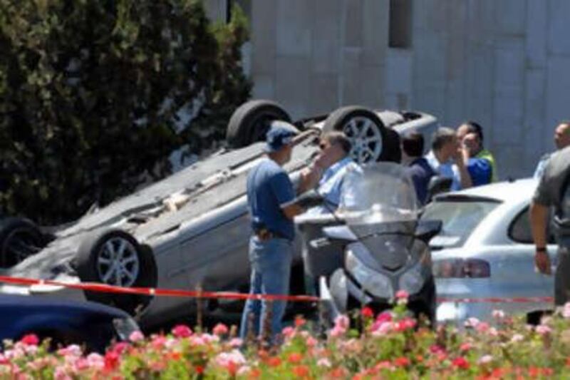 A handout picture released by Israeli government press office shows the scene of a bulldozer attack in Jerualem's King George Street.