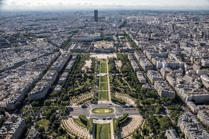 A general view taken from the Eiffel Tower shows the giant landart painting part of the project entitled 'Beyond Walls' by French artist Saype  in the Champs-de-Mars garden in Paris. EPA