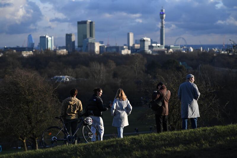 People take daily exercise at Primrose Hill, north London. AFP