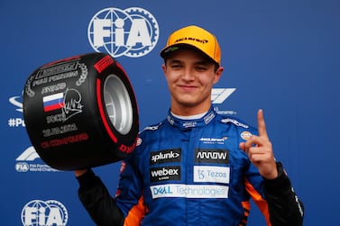 SOCHI, RUSSIA - SEPTEMBER 25: Pole position qualifier Lando Norris of Great Britain and McLaren F1 celebrates in parc ferme during qualifying ahead of the F1 Grand Prix of Russia at Sochi Autodrom on September 25, 2021 in Sochi, Russia. (Photo by Yuri Kochetkov - Pool / Getty Images)