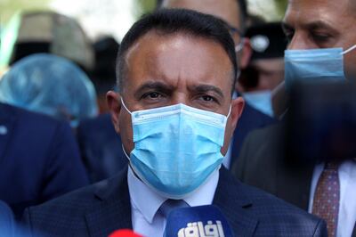 Iraqi Health Minister Hassan al-Tamimi speaks to journalists as he tours Baghdad's suburb of Sadr City on May 21, 2020, during a COVID-19 testing campaign as part of measures taken by the authorities aimed at containing the spread of the novel coronavirus. - Certain neighbourhoods in the Iraqi capital Baghdad began a full lockdown for two weeks as of yesterday, in reaction to a spike in coronavirus infections since restrictions were relaxed. (Photo by AHMAD AL-RUBAYE / AFP)