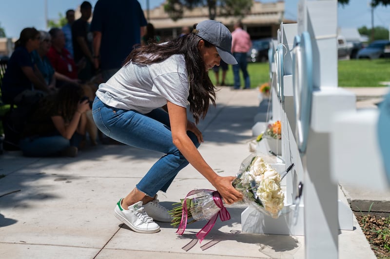 Meghan, Duchess of Sussex, leaves flowers at a memorial site for the victims killed in this week's primary school shooting in Uvalde, Texas. AP