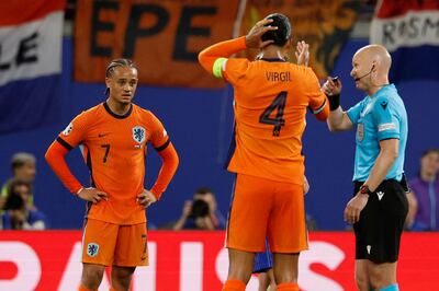 Netherlands' Xavi Simons, left, reacts after the goal he scored was disallowed by referee Anthony Taylor at the Leipzig Stadium. AFP
