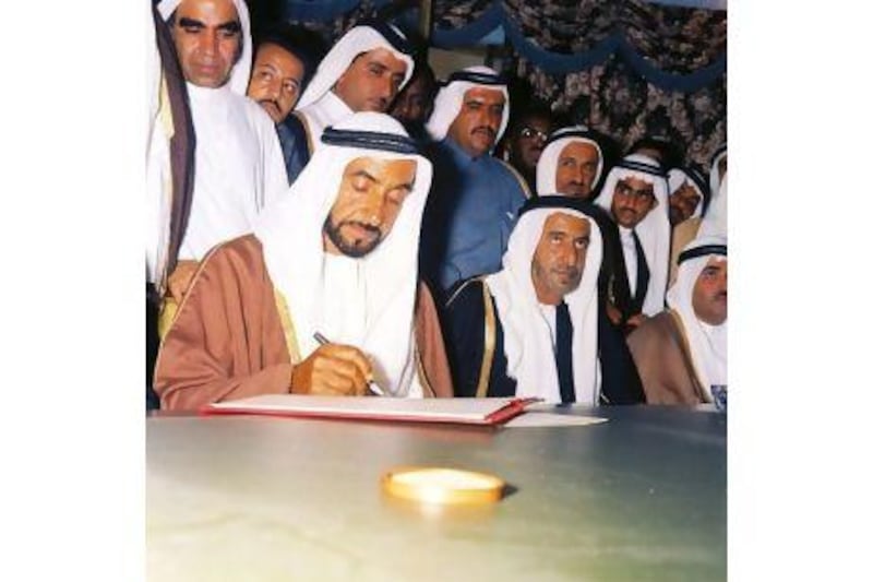Barely an hour after becoming President of the UAE, Sheikh Zayed signs the Treaty of Friendship in this iconic photography by Ramesh Shukla. On the right are Sheikh Rashid of Dubai and Sheikh Khalid of Sharjah. Mahdi al Tajir stands immediately behind Sheikh Zayed.