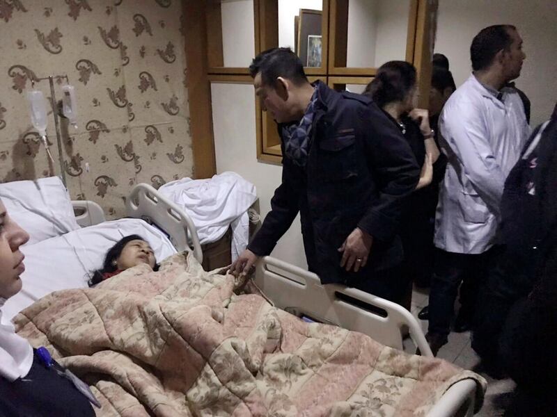 The Vietnamese ambassador visits an injured Vietnamese tourist at a hospital in Cairo. AP Photo