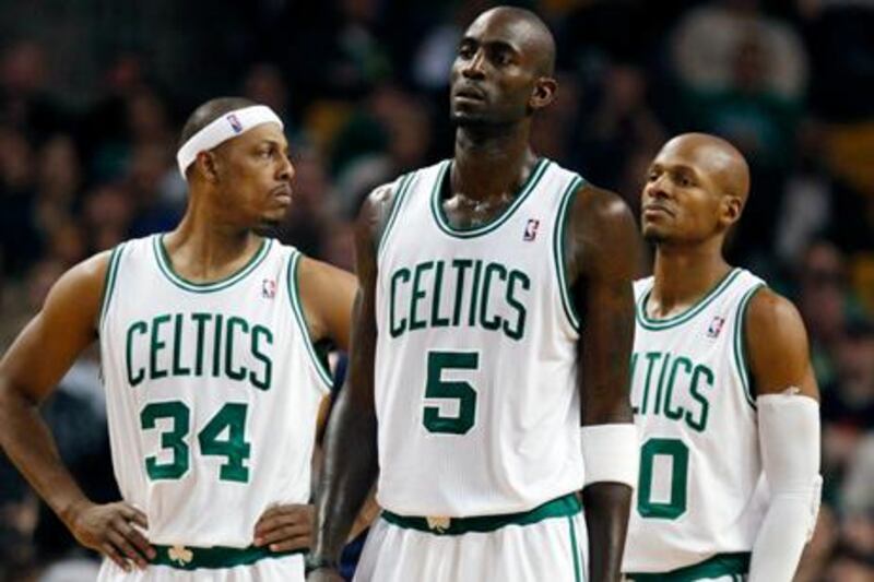 Boston Celtics' Paul Pierce (34), Boston Celtics' Kevin Garnett (5) and Boston Celtics' Ray Allen (20) wait for play to resume after a timeout in the fourth quarter of an NBA basketball game against the Indiana Pacers in Boston, Friday, Jan. 6, 2012. The Pacers won 87-74. (AP Photo/Michael Dwyer)