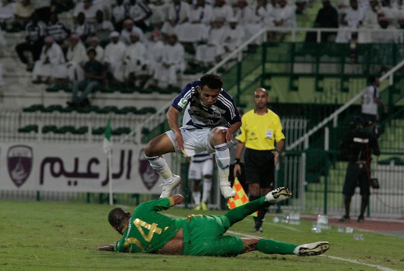 Dubai, United Arab Emirates - November 8, 2012.  Khaled Abdulrahman ( no 15 of Al Ain ) against Essa Obaid ( no 24 of Al Shabab) at the ongoing Etisalat Pro League.  ( Jeffrey E Biteng / The National )