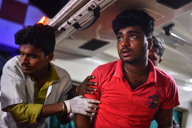 An injured passenger who was affected by the triple train accident in Odisha is transported to Rajiv Gandhi government hospital. EPA