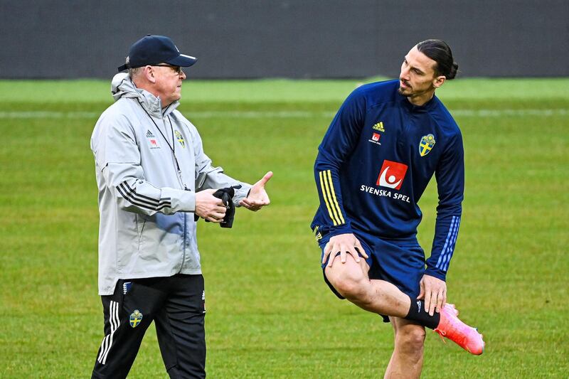 Sweden's Zlatan Ibrahimovic speaks with manager Janne Andersson. AFP