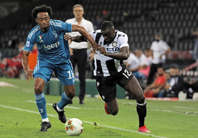 Juventus' Juan Cuadrado, left, and Udinense's Ken Sema in action during the Serie A Soccer match on Thursday. AP