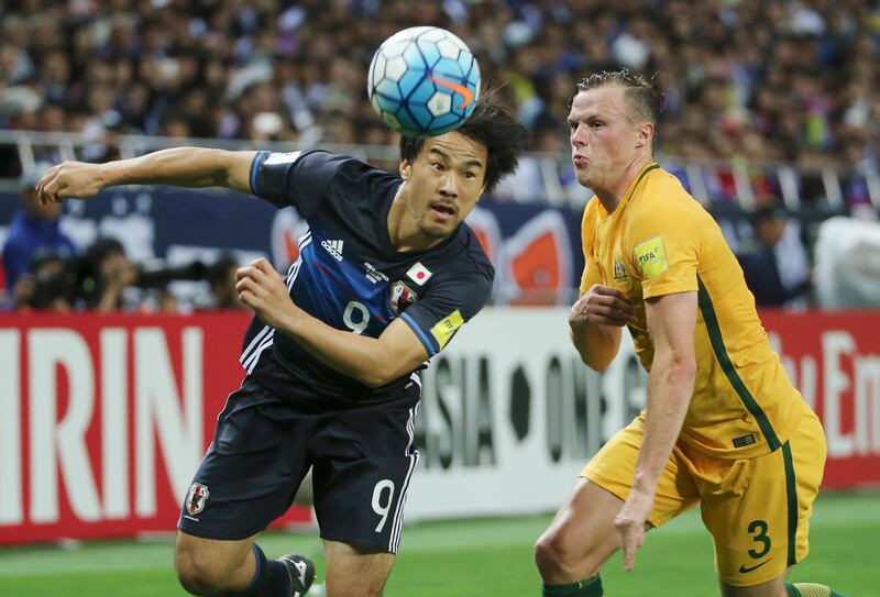 Japan's Shinji Okazaki, left, and Australia's Brad Smith battle for the ball during their World Cup Group B qualifying soccer match in Saitama, Japan, Thursday, Aug. 31, 2017. (AP Photo/Koji Sasahara)